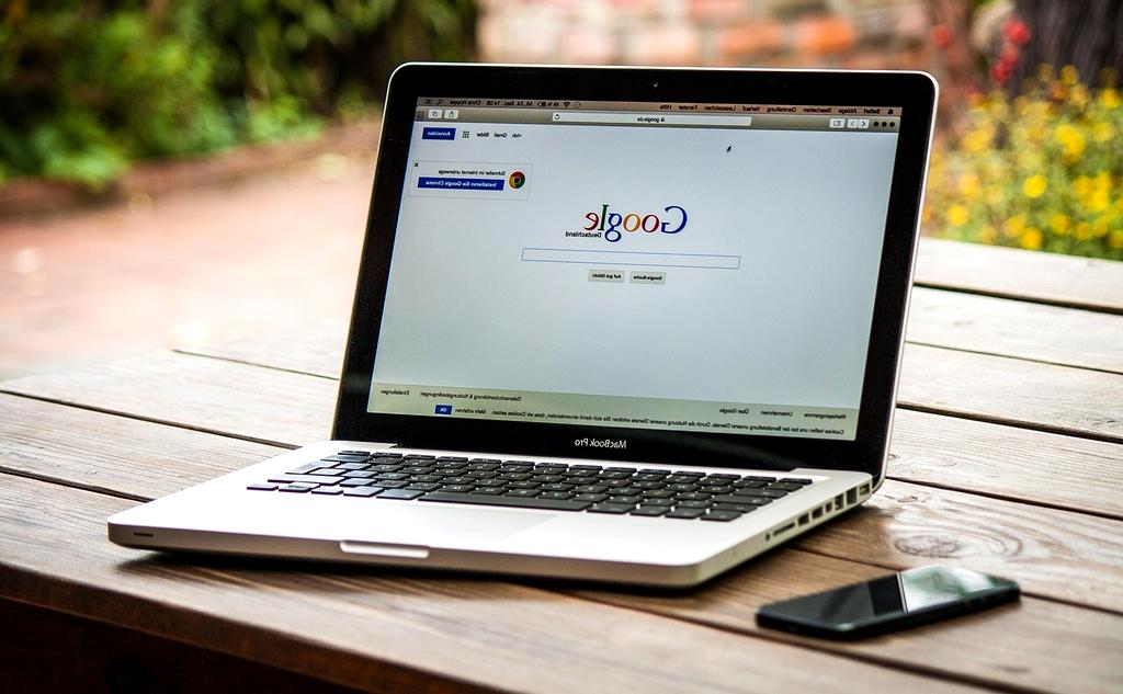 Modern computer setup with multiple browser windows showing various websites and search results
