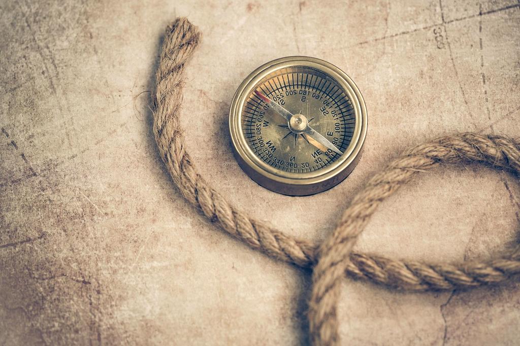 Person navigating on a laptop with multiple browser tabs open