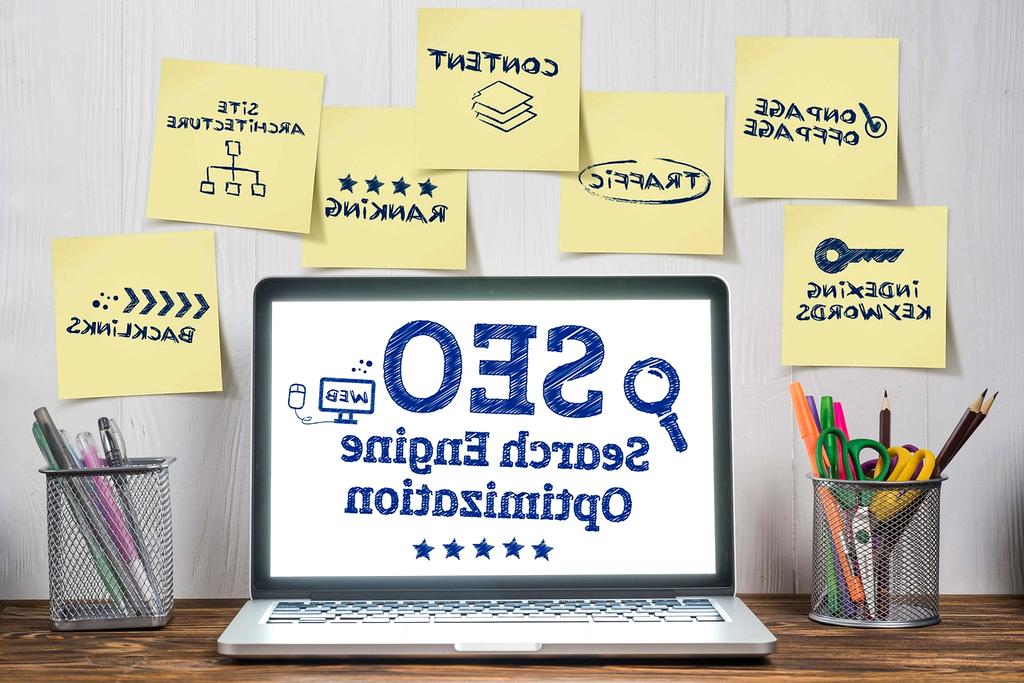 Person typing search queries on a laptop surrounded by floating search icons